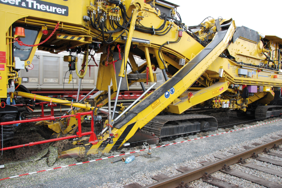 On/off-track ZRM 350 ballast cleaning machine during cleaning in a station area (Austria)