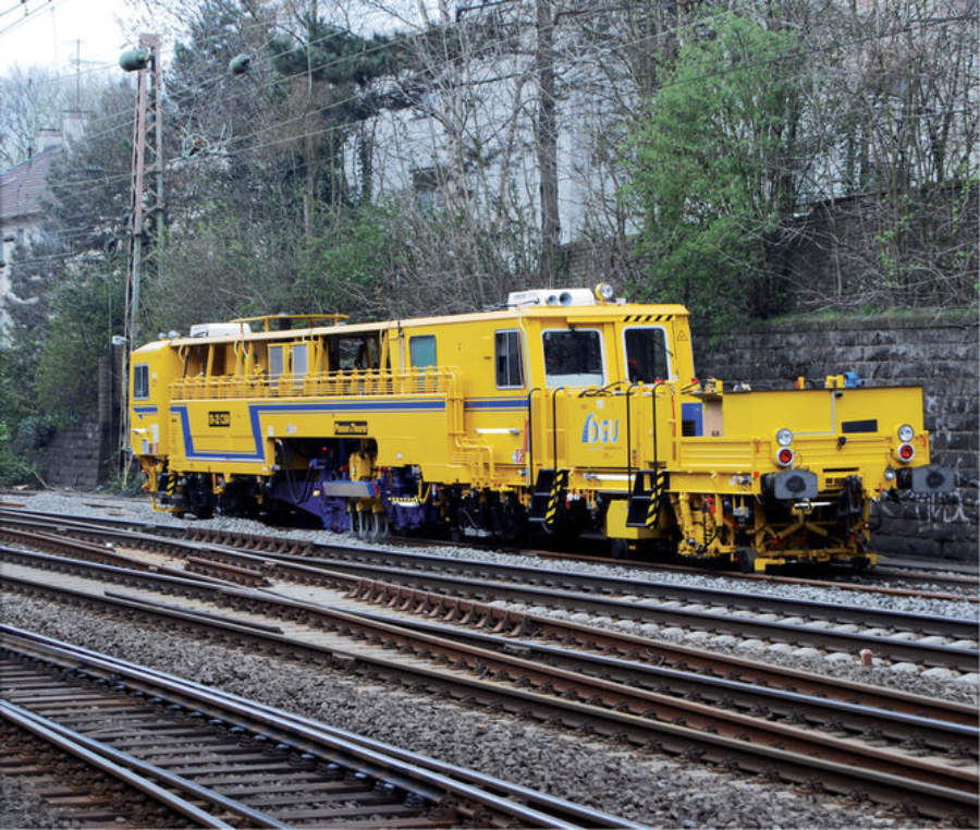 Duomatic 09-32 CSM during tamping after track renewal in Germany